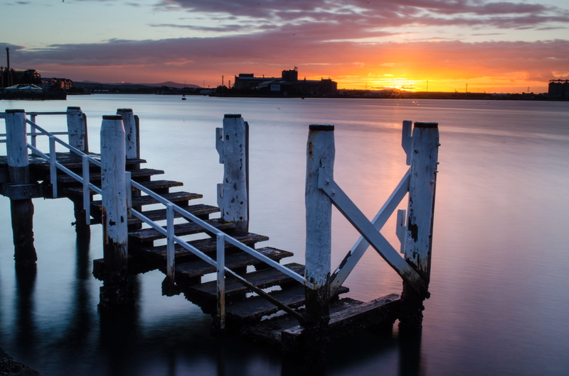 scenics - nature, connection, beauty in nature, 4K, tranquil scene, sunset, sea, wooden post, bridge, no people, water, reflection, cloud - sky, railing