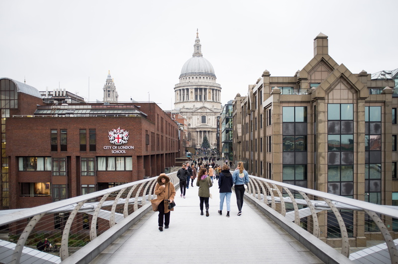 lifestyles, london, real people, footbridge, building exterior, outdoors, sky, united kingdom, people, rear view, warm clothing, st. pauls cathedral, millenium bridge