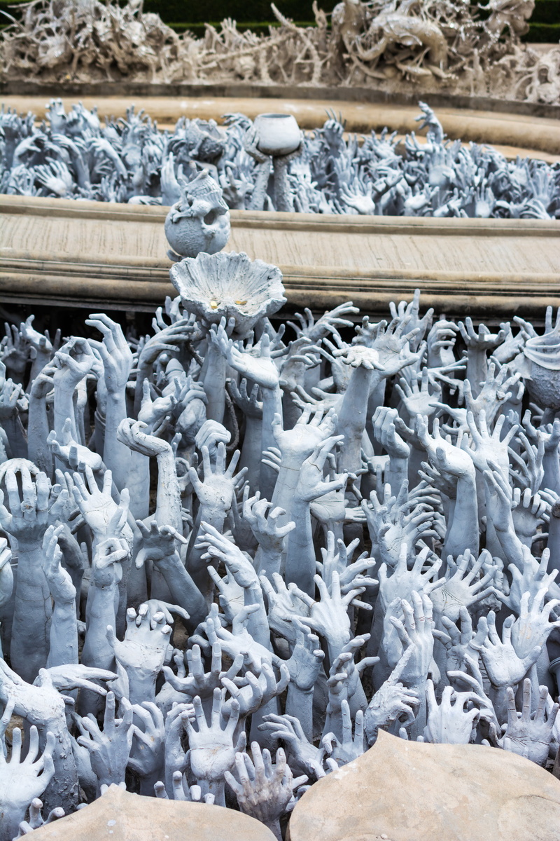 struggling hands, white temple, 5K, outdoors, frozen, technology, hands, statue, water, no people, connection, abundance, large group of objects, thailand