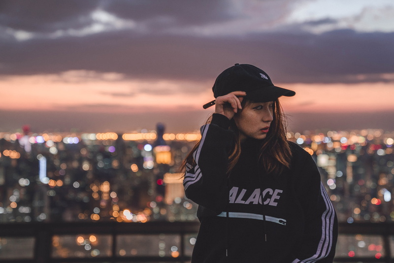 real people, looking, architecture, rooftop, beautiful woman, illuminated, light, waist up, girl, outdoors, china, leisure activity, 4K, focus on foreground