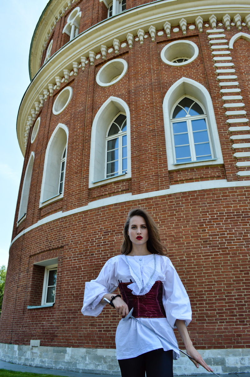 beautiful woman, leisure activity, historical, musketeer, sword, palace, front view, young women, 16 21, lifestyles, brick, actress, women, history, building