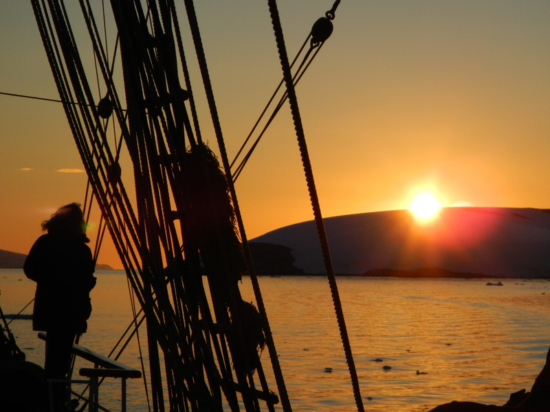 standing, tallship, ocean, yellow, nautical vessel, mast, silhouette, brown, nature, men, sailboat, mountain, rigging, bird, transportation, sky, ship