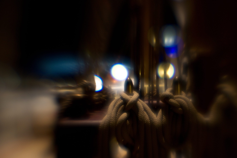 emotion, lighting equipment, street, nautical, ship, rigging, architecture, decoration, human body part, 5K, illuminated, selective focus, indoors, close-up