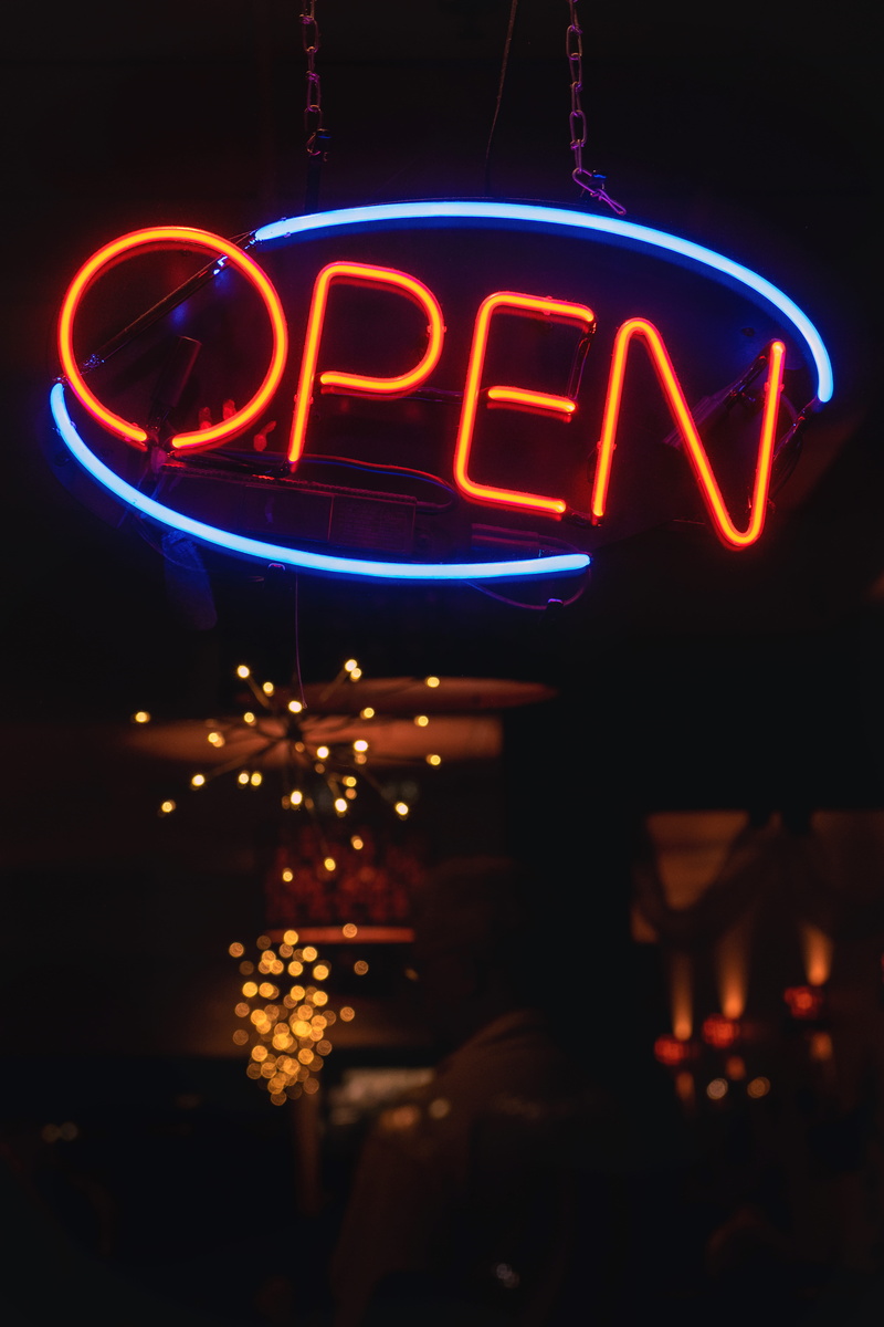 light - natural phenomenon, blur, outdoors, neon, oval, sign, orange, celebration, open, architecture, warmly, blue, communication, western script, signage