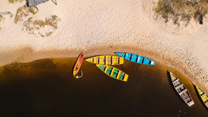 sunset, travel destinations, built structure, water, drone cam, vehicle, drone view, boats, sea, from above, row, colors, holiday, high angle view, drone footage
