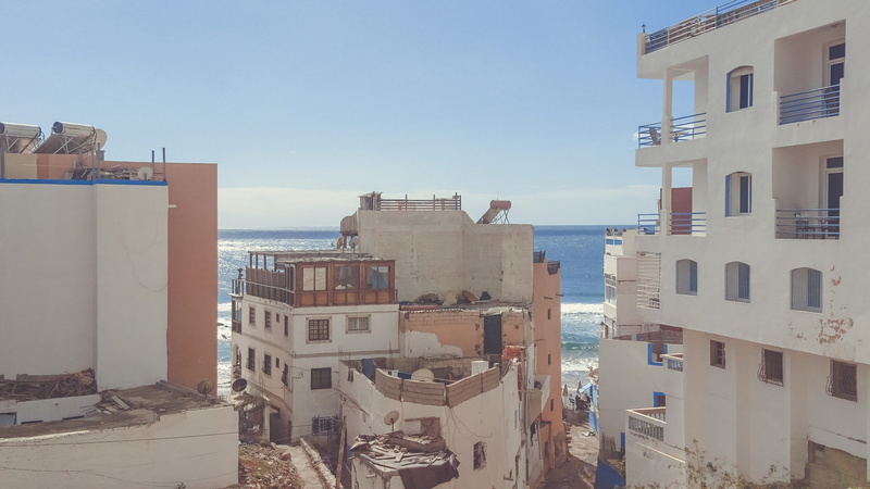 window, residential district, sunlight, sky, shore, white, day, high angle view, body, building, ocean, apartment, aerial, nature, no people, clear sky