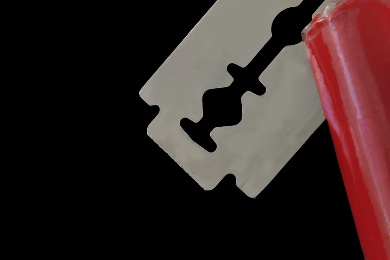 5K, red, no people, copy space, razor blade, indoors, metal, close-up, blade, steel, single object, shaving, shape, focus on foreground, studio shot, black background