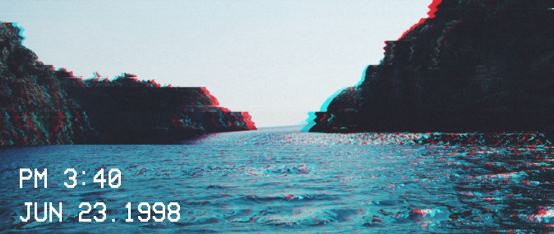1998 (Year), text, clear sky, nature, beach, 2K, island, day, water, rock, no people, rock - object, communication, architecture, solid, sea, sky, rock formation