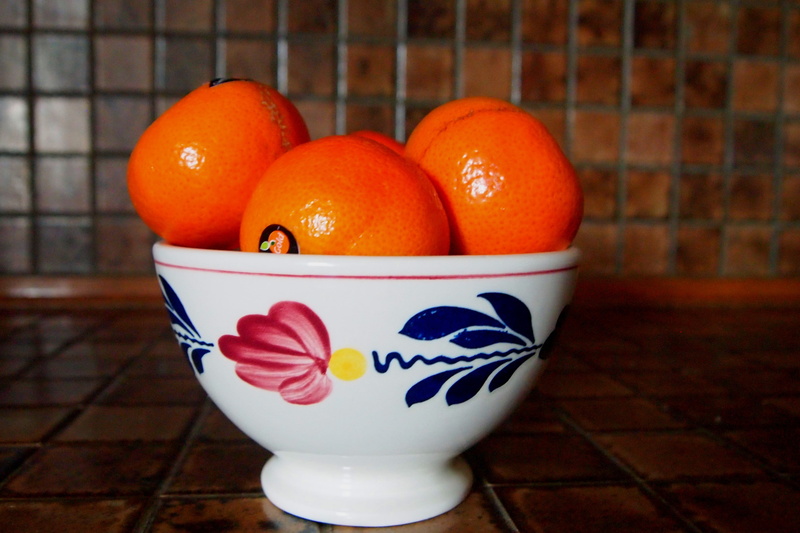 floral pattern, fruit, healthy eating, flooring, focus on foreground, bowl, indoors, close-up, creativity, dish, table, mandarin, freshness, no people