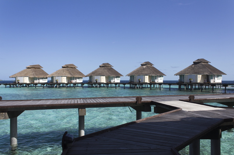 roof, summer, view, outdoors, architecture, wood - material, day, building, over the water, sea, tranquility, cabins, holiday, swimming pool, beauty in nature
