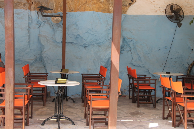 travel, indoors, industry, orange color, chair, day, wall - building feature, electric lamp, illuminated, hospitable, tavern, table, gastronomy, seat, empty