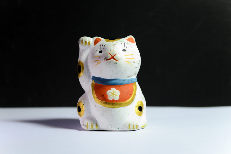 luck, charm, mammal, lucky, doll, creativity, fortune, lucky charm, indoors, food and drink, ceramics, art and craft, white color, neko, craft, representation
