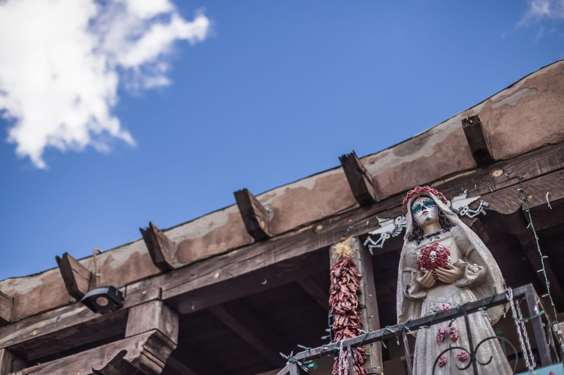 representation, wearing, nature, mammal, art and craft, human representation, built structure, balcony, statue, sculpture, architecture, cloud, building exterior