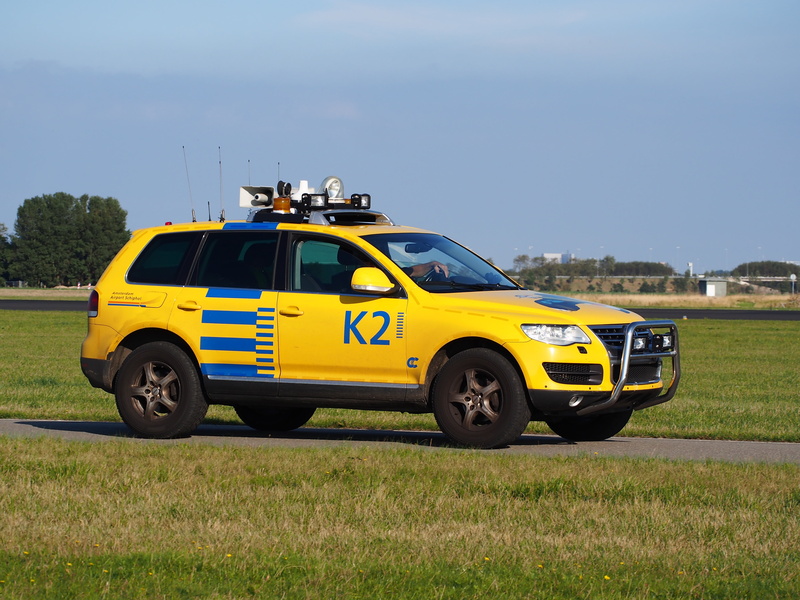 security, field, speed, ground support, land Vehicle, tuareg, engine, sunlight, green color, sky, land, no people, volkswagen, airport, schiphol, vehicle