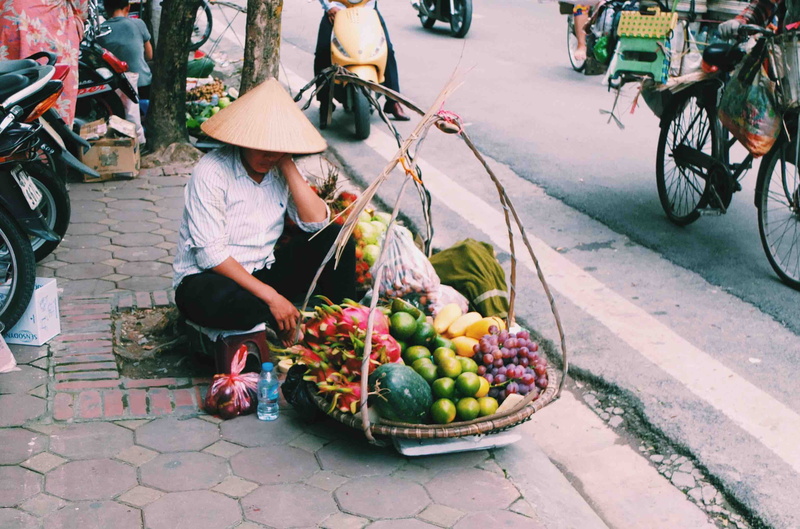 one person, street, men, world, land vehicle, food, incidental people, container, transportation, selling, road, food and drink, street market, nomad, vendor