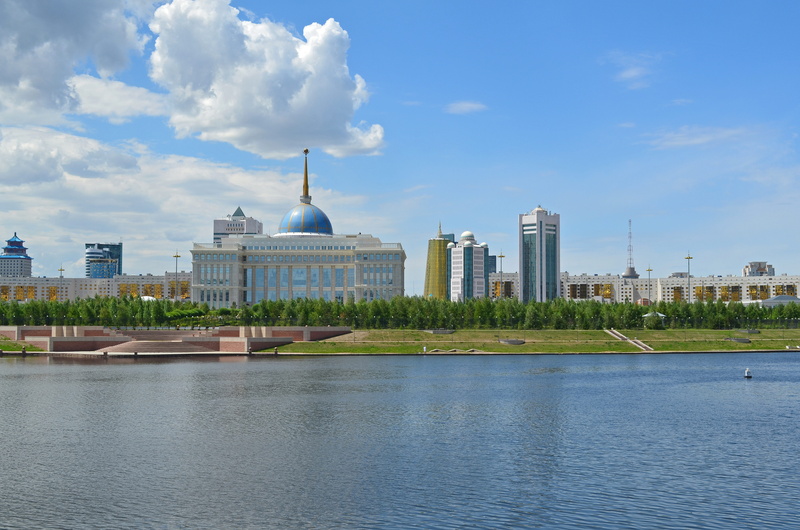 urban skyline, cityscape, day, quay, landscape, nature, spire, skyscraper, palace of the president of the republic of kazakhstan, outdoors, water, waterfront