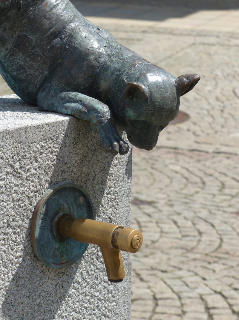 pedestrian zone, downtown, craft, city, paving stone, faucet, sculpture, day, metal, human representation, creativity, nature, statue, no people, male likeness