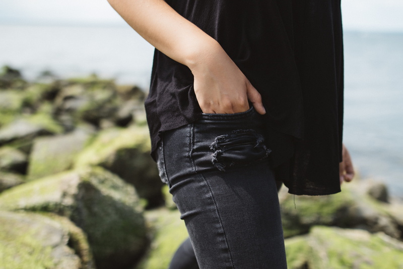 arm, hand, inserting, walking, casual clothing, bottoms, limb, human body part, stone, day, rock - object, focus on foreground, holiday, young adult, female