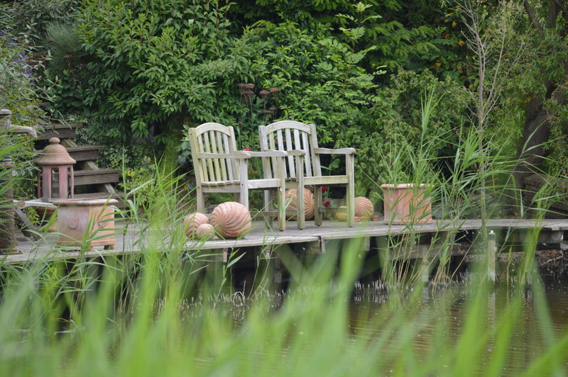 outdoors, rest, flowers, out, break, chairs, leaf, old chair, focus on background, quiet zone, no people, plant, seat, 5K, beauty in nature, leisure, grass