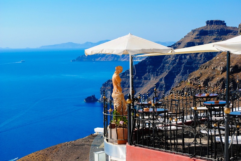 transportation, umbrella, water, statue, destination, place, aegean, old, scenics - nature, evening, sunlight, landscape, mountain, day, building, santorini