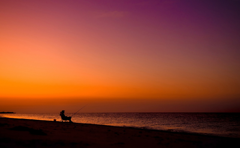 beauty in nature, Silhouette, land, orange color, person, Beach, outdoors, copy space, sky, horizon, one person, sea, leisure activity, deck, Nature, scenics - nature