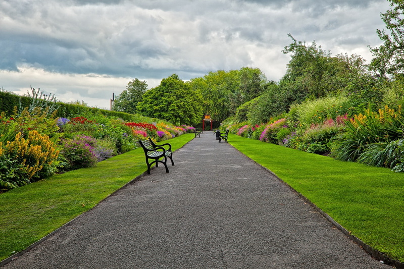 leaf, beauty In Nature, landscaped, blue, tree, road, season, outdoors, formal Garden, field, grass, plant, gray, springtime, cloud - sky, diminishing perspective