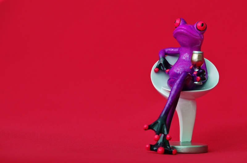 art and craft, relax, futuristic, frog, cozy, seat, small, rest, human representation, male likeness, pop Art, pink background, table, robot, wine, colored background
