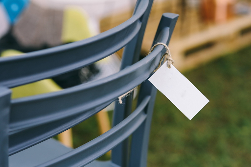 seats, railing, sunlight, silver colored, group of objects, no People, outdoors, selective focus, message, sunny, hanging, blank, various, outside, business