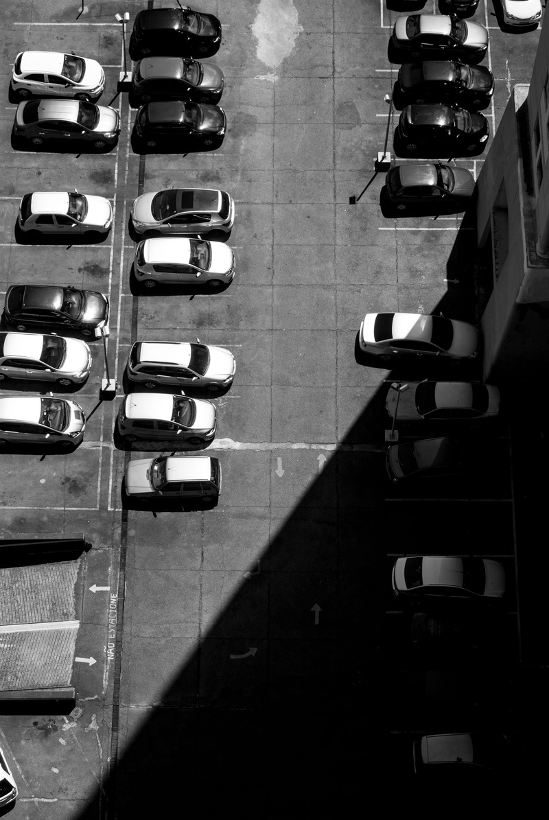 empty, suv, chair, indoors, land vehicle, blacknwhite, bumper, flooring, dark, seat, repetition, shadow, parking, mode of transportation, parking lot, brazil