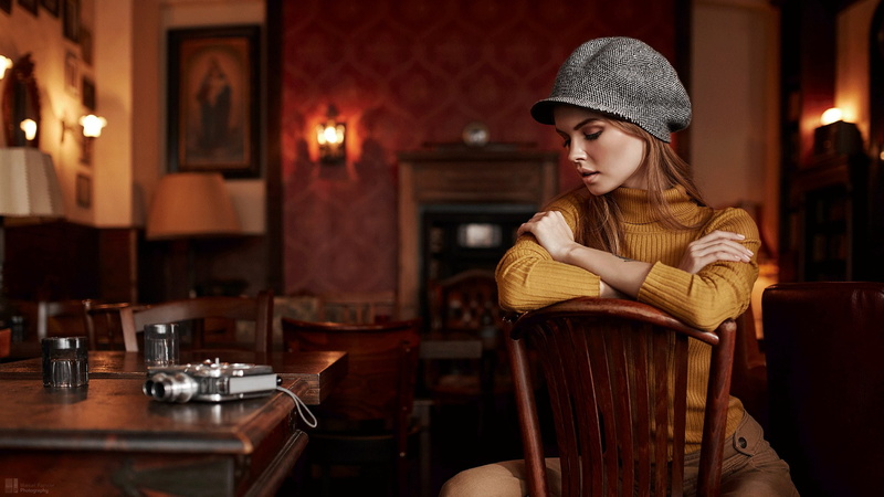 model, sitting, table, arms crossed, camera, Anastasia Scheglova, chair, 1080P, tattoo, blonde, women, portrait