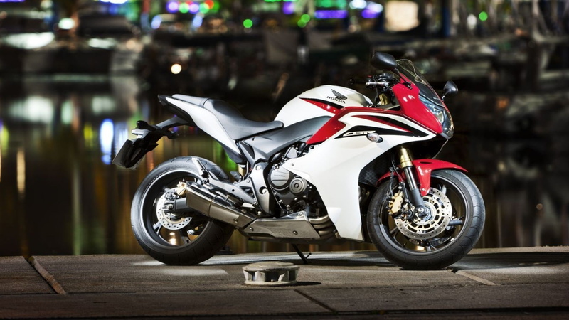 no people, crash helmet, Honda, outdoors, Honda CBR, riding, motorcycle, sport, helmet, land vehicle, parking, mode of transportation, stationary, focus on foreground