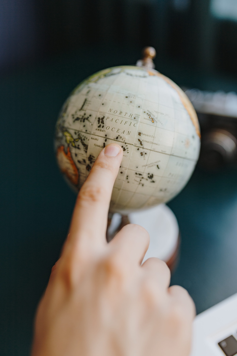 travel, real people, globe, showing, selective focus, geography, lifestyles, map, focus on foreground, male, part, indoors, close-up, 5K, sphere, high angle view
