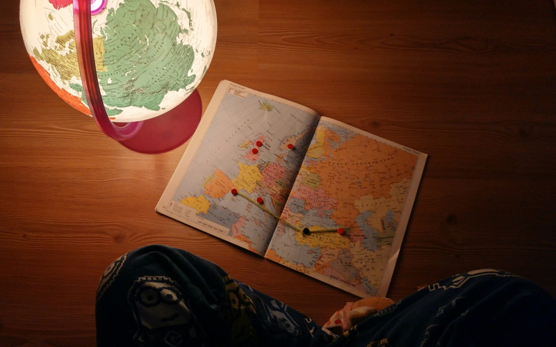 wood - material, geography, indoors, map, paper, travel, 2K, leisure activity, floor, travel plan, sitting, holding, explore, near, adult, reading, panel