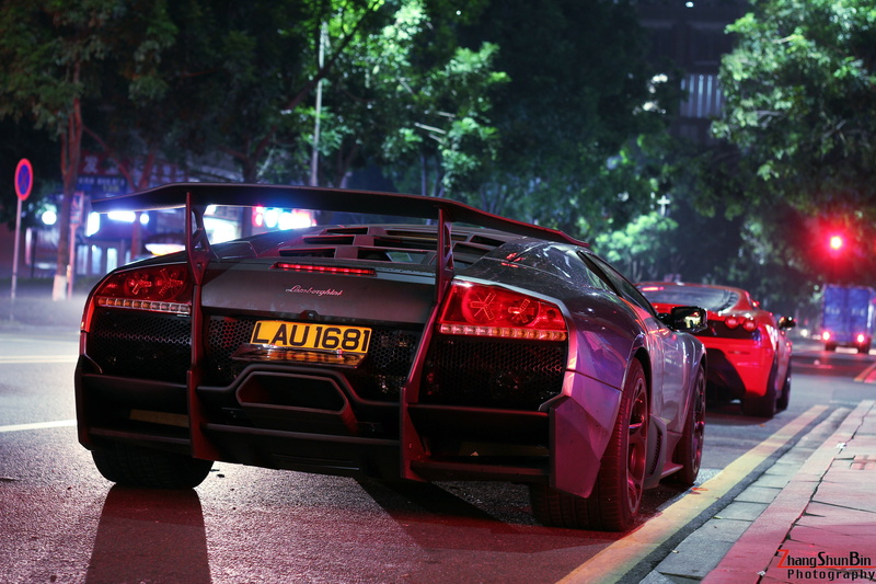 transportation, red, land vehicle, tree, architecture, Lamborghini Murcielago, taxi, text, outdoors, government, city, focus on foreground, mode of transportation