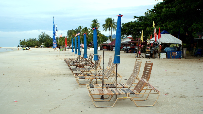 langkawi, beach, tourism, transportation, incidental people, sea, day, ocean, flag, resort, sky, seat, cenang, plant, chair, water, island, umbrella, seashore