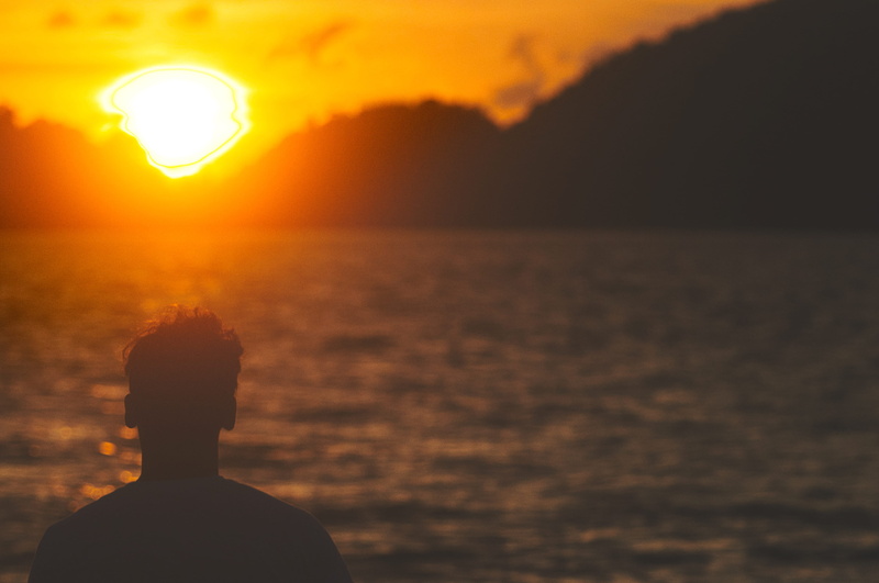 focus on foreground, horizon, beauty in nature, silhouette, ocean, horizon over water, meditation, outdoors, looking at view, stare into the sunset, sky