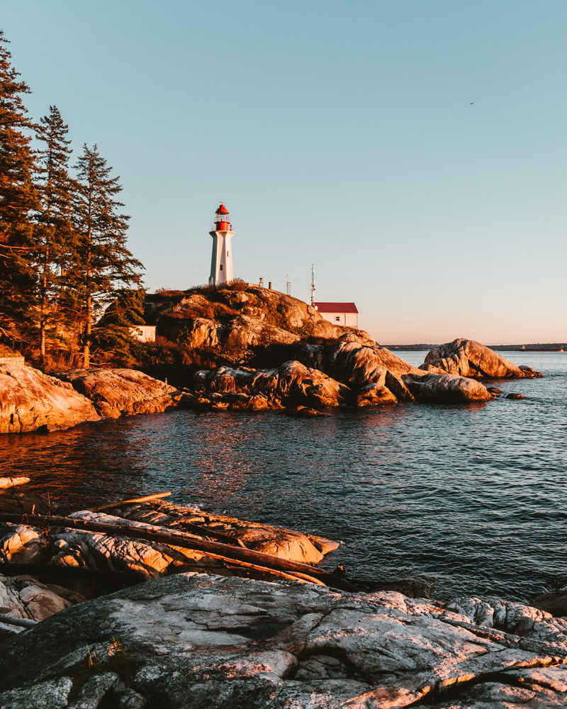 beacon, rocks, sky, golden hour, one person, leisure activity, architecture, water, building, beauty in nature, nature, guidance, ocean, rock, cave, promontory