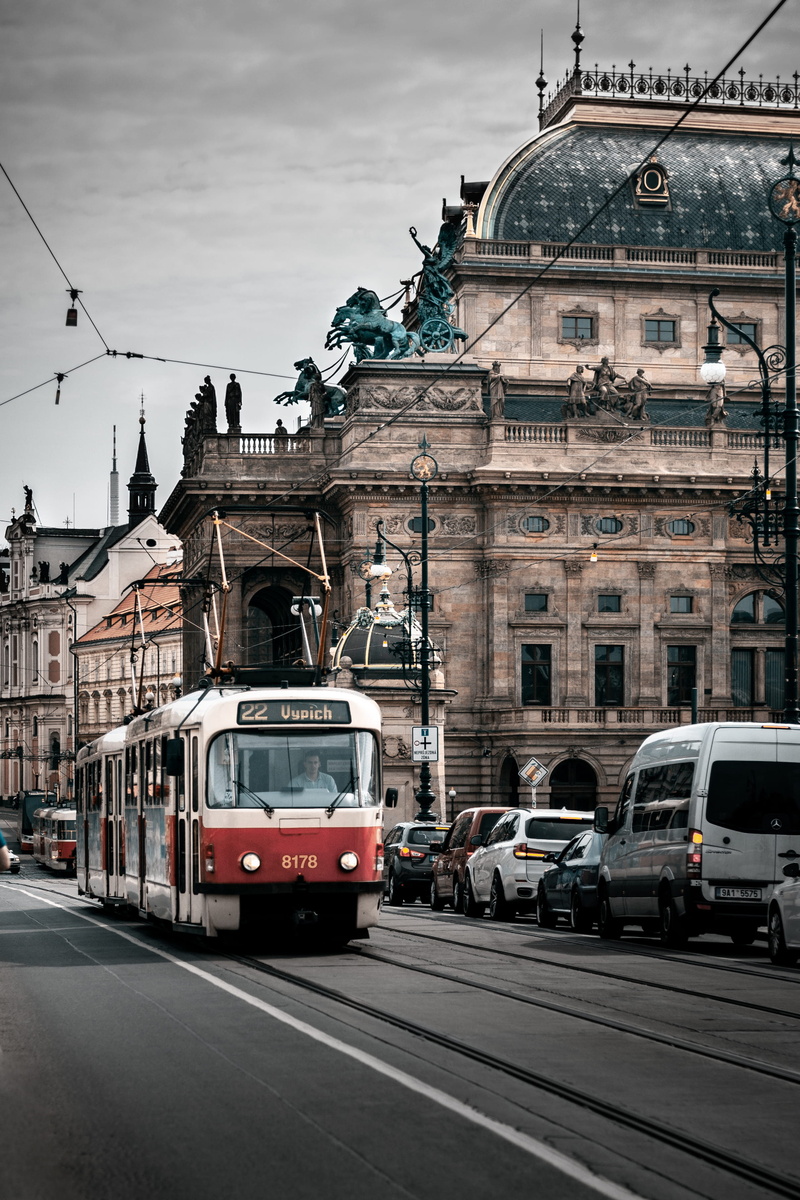 double-decker bus, building exterior, outdoors, prague, city, worship, rail transportation, sky, railroad track, car, streetcar, vehicle, urban, church