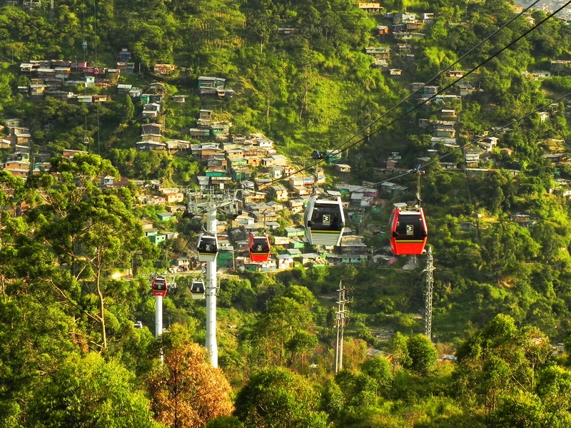 land vehicle, traffic, antioquia, cable, cart, no people, medellin, colombia, transportation, nature, hill, green color, tree, metrocable, landscape, slum