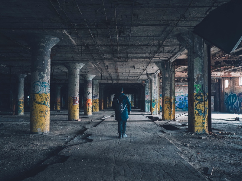 spray paint, men, lifestyles, abandoned, tresspass, urban decay, man, ceiling, one man only, graffiti, rear view, one person, transportation, architectural column