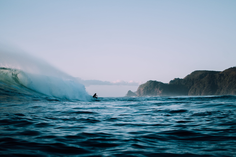 people, non-urban scene, scenics - nature, waves, ocean, day, vacation, sea, beach, large, land, water, person, blue, no people, motion, power in nature