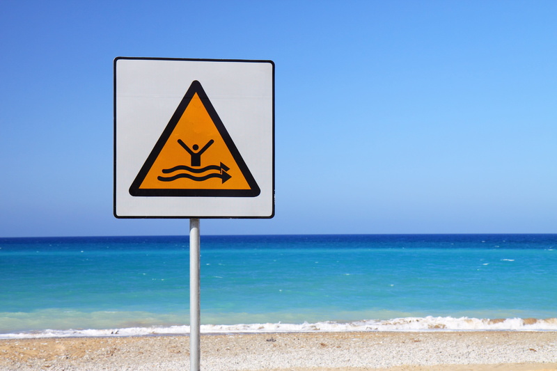 landscape, outdoors, clear sky, strong, wet, shape, no people, yellow, waves, water, warning Symbol, horizon over water, coastline, communication, day