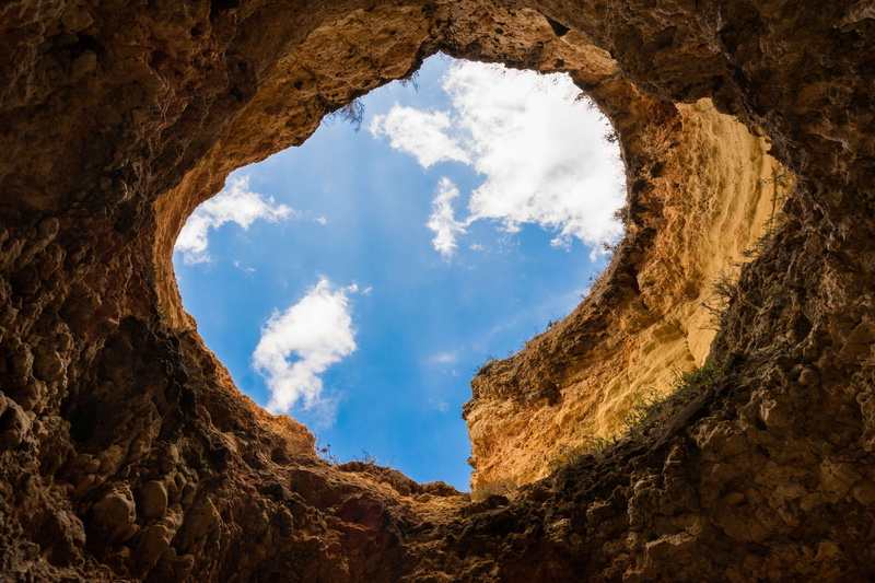 hole, beauty in nature, shape, 4K, scenics - nature, solid, blue, sky, rock, architecture, trench, rock - object, history, tranquility, rock formation