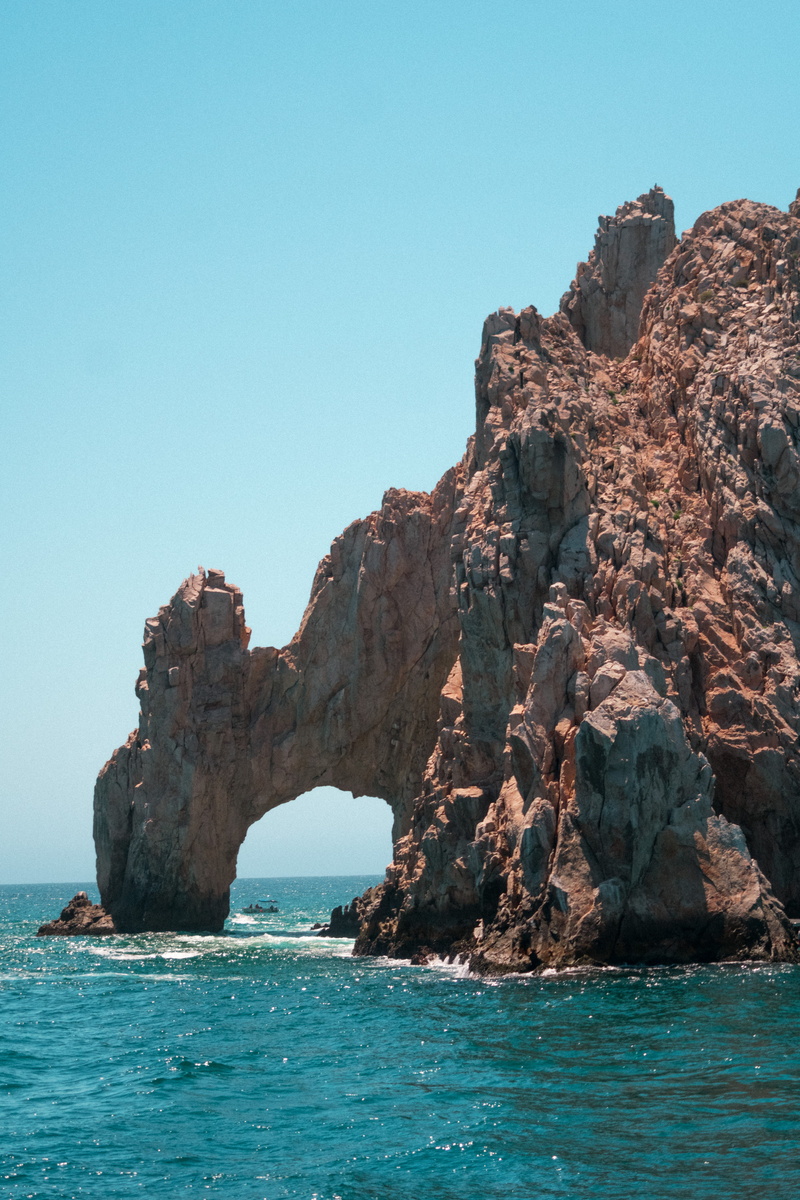tranquility, solid, clear sky, arch, rock, tranquil scene, water, boat, sky, cabo, rock formation, nature, waterfront, copy space, outdoors, day, no people