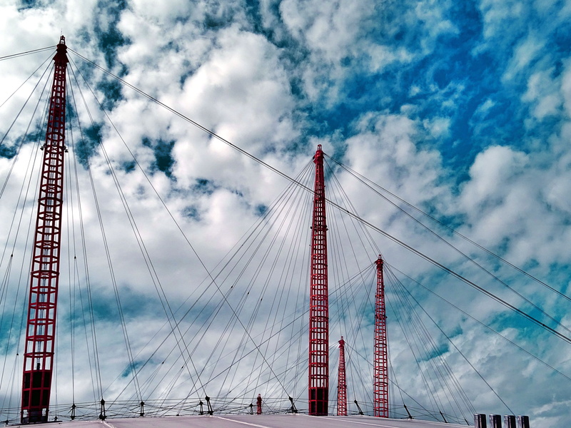 architecture, cityscape, travel destinations, transportation, clouds, bridge, cable, travel, tourism, wires, built structure, steel cable, connection, low angle view