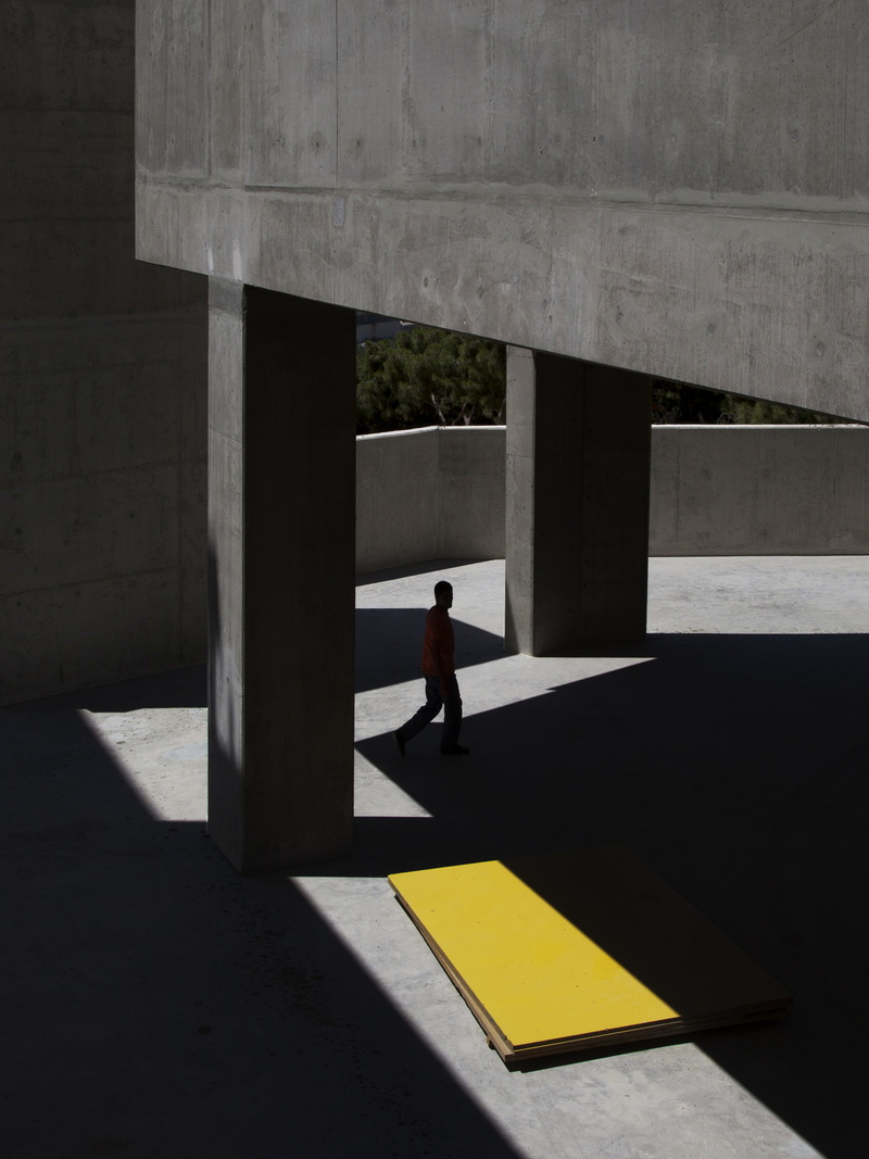 architecture, architectural column, column, shadow, one person, transportation, building, outdoors, side view, on the move, iPad, iPhone, concrete, Ipod