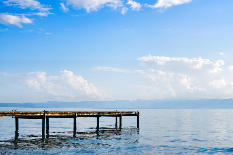 sea, tranquil scene, calm, wood - material, wooden post, 2K, blue, lake, water, day, boat ramp, idyllic, outdoors, built structure, tranquility, sky, lake ohrid