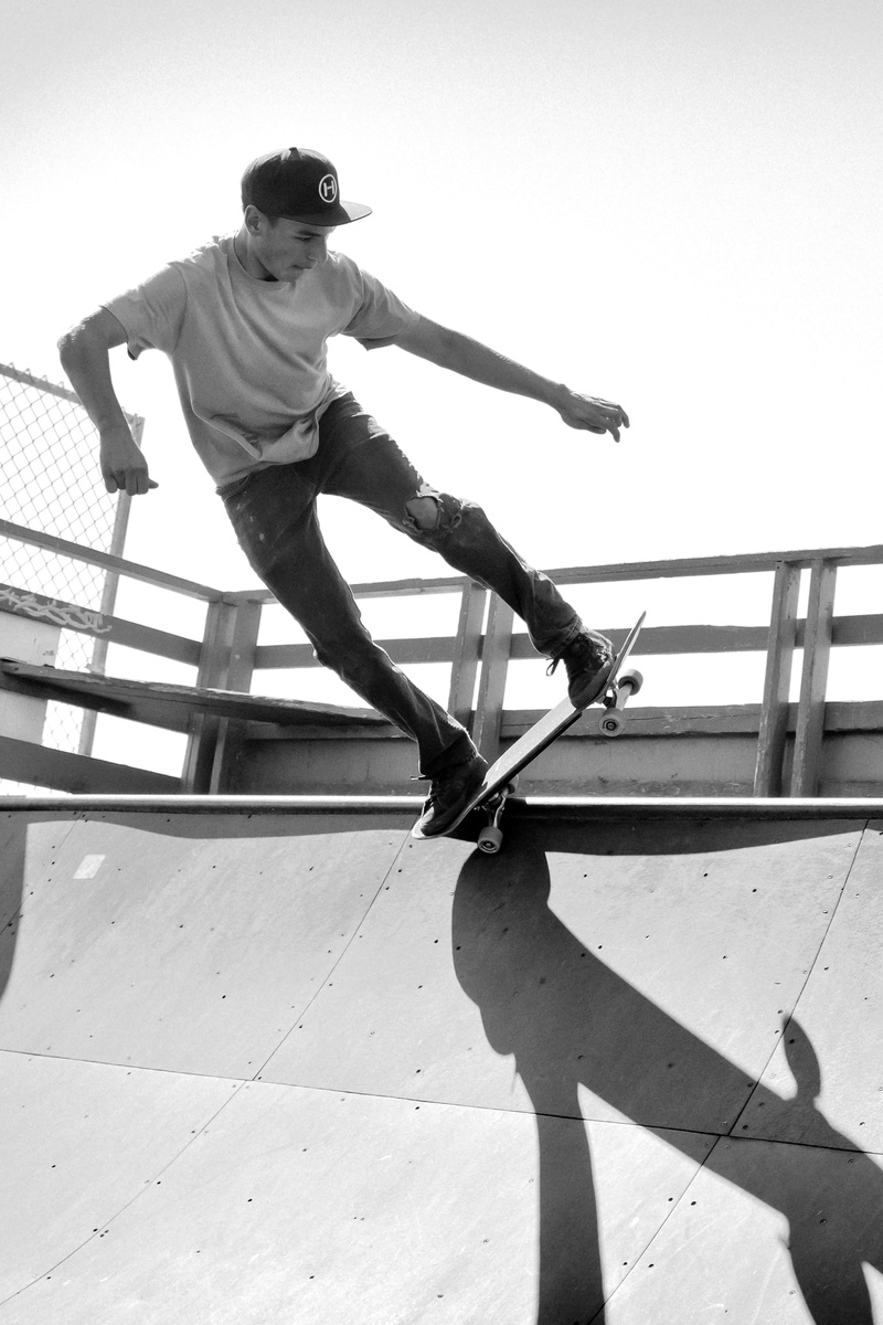 jumping, balance, black-and-white, motion, front view, sport, real people, railing, men, fashion, photography, daylight, wear, skater, jump, day, skill