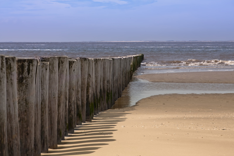 sun, north sea, wind, tranquility, flowing water, sky, clouds, wooden post, holland, piles, mood, spray, horizon over water, ameland, land, wood - material