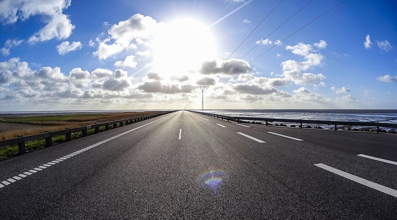 outdoors, denmark, on the go, sea, mood, highway, no people, wadden sea, blue, symbol, water, city, travel, mode of transportation, transportation, sun